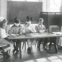 Casa dei bambini, U.S.A. Children in an American Children's House doing different exercises. The girl on the left is feeling the letters of the moveable alphabet without looking. Photo: McClure, New York, 1912. The photograph was also published in the Berliner Illustrirte Zeitung in 1912 - T. Müller, R. Schneider, <em>Lehrmaterialien 1913-1935. Möbel und Architektur. Techning Meterials 1913-1935. Furniture and Architecture</em>, München, Prestel Verlag, 2002, p.102$$$469